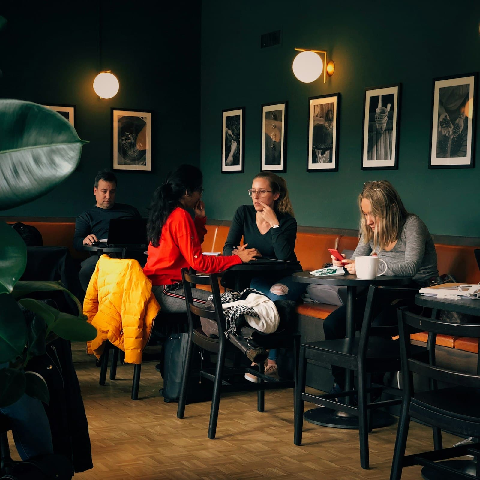 Groups of people talking in a café